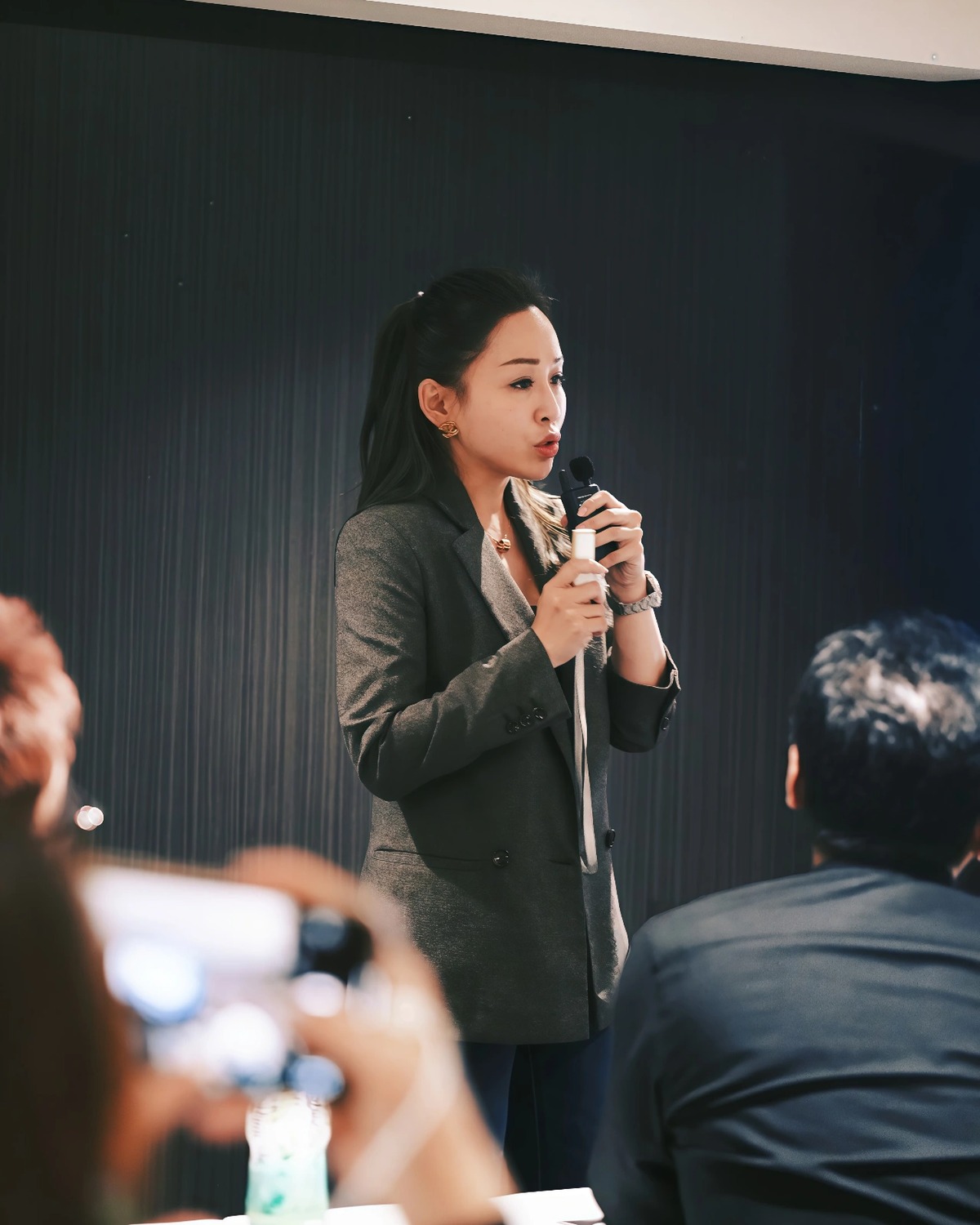 Samantha Loh delivering a keynote on authentication standards.